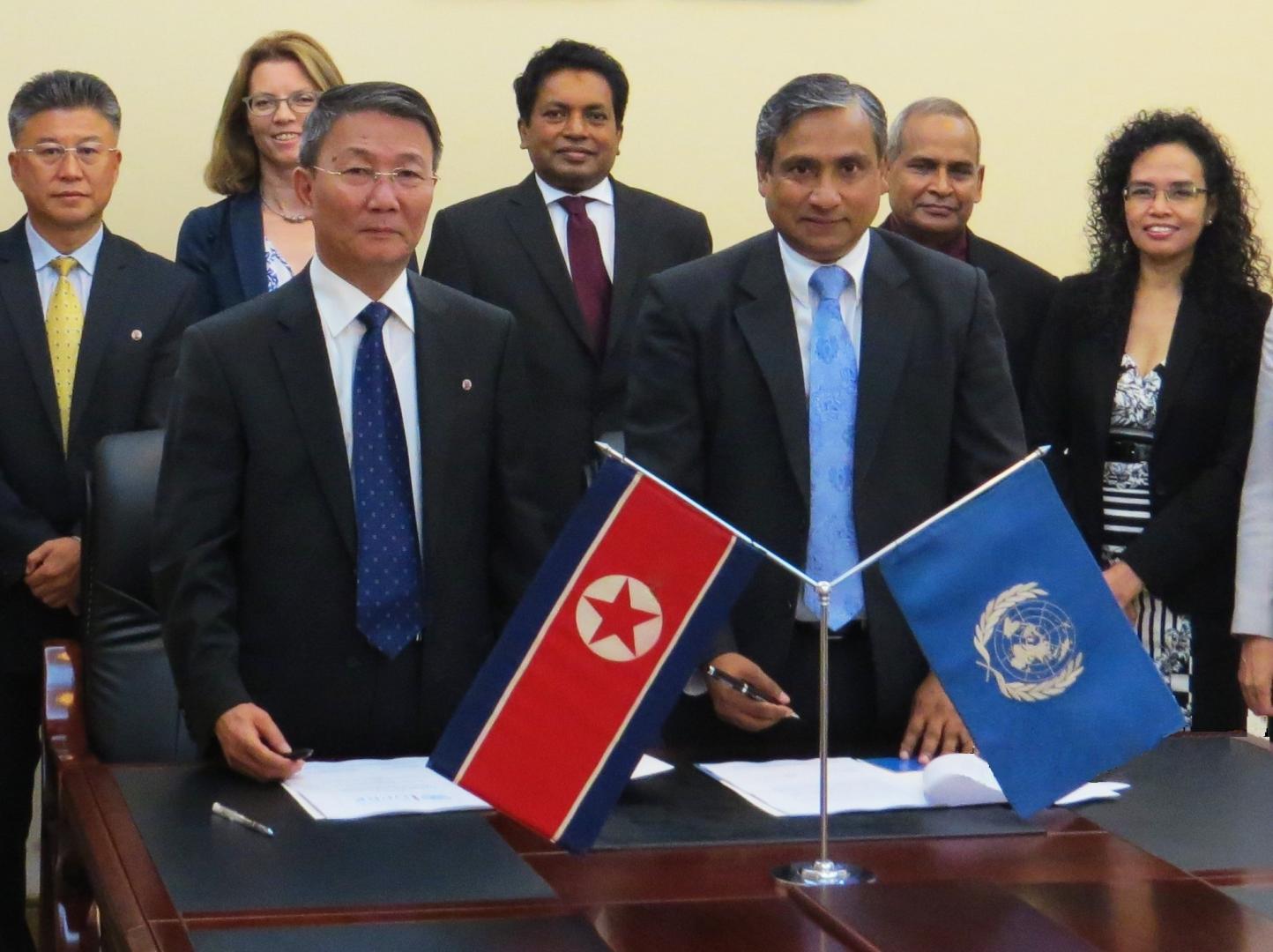 Signature ceremony of The United Nations Strategic Framework for DPRK on 1 September 2016. (left) Mr Kim Chang Min, Secretary-General, National Coordinating Committee, Ministry of Foreign Affairs of DPRK; (right) Mr Tapan Mishra, UN Resident Coordinator for DPRK